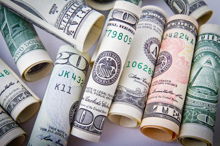 Close-up of rolled US dollar bills symbolizing wealth, financial success, and currency. Make Money With Wealthy Affiliate
